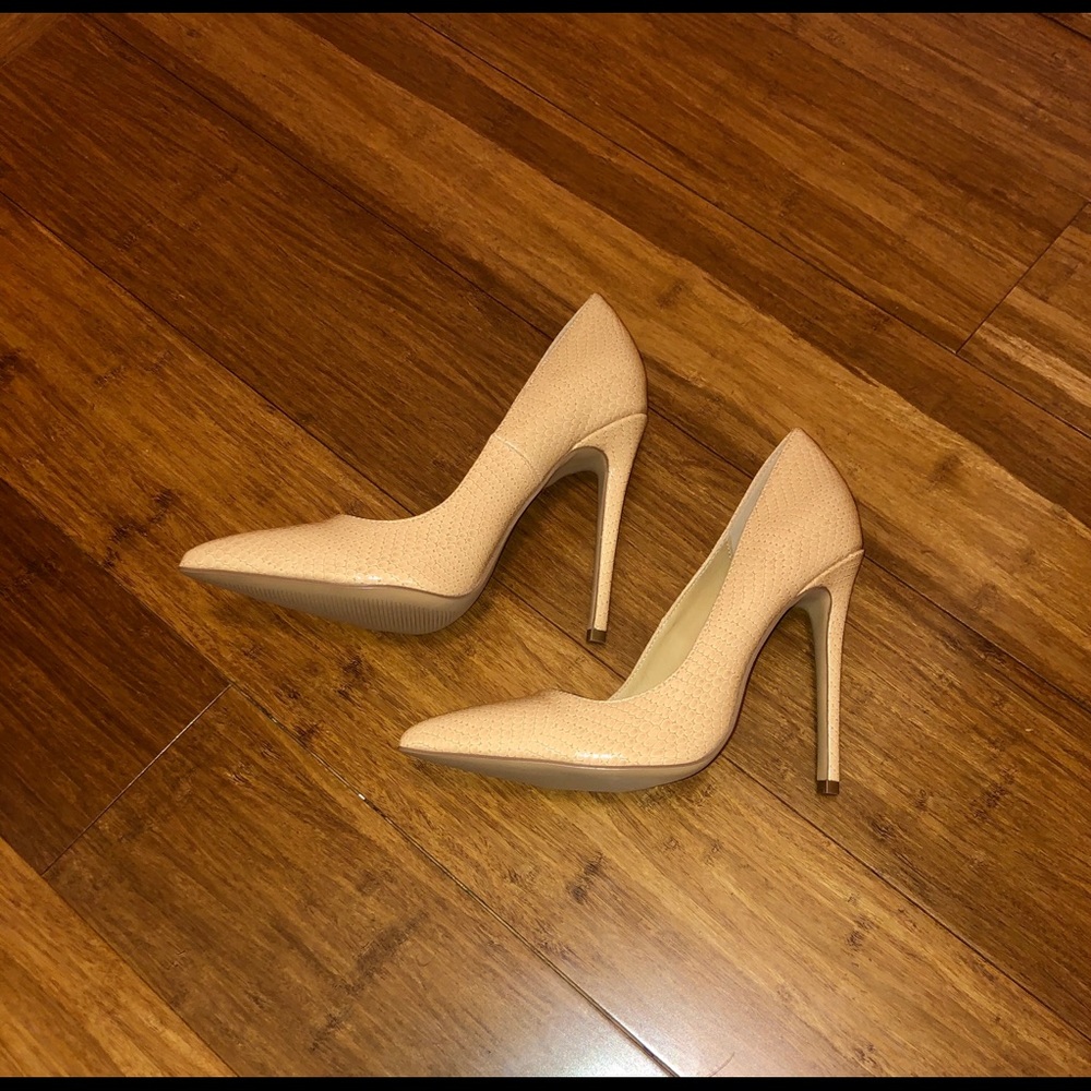 Snake print patent pumps